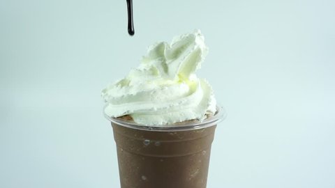 Cocoa in cup topped whip cream chocolate on white background, Front view.