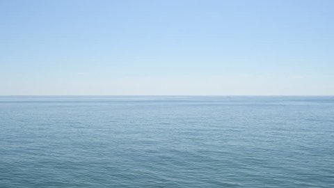 Blue calm Mediterranean sea with little waves in the morning