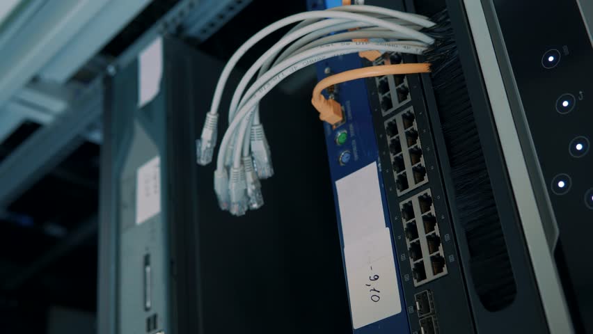 IT Engineer Patching Network Equipment In Server Room. Maintenance Work In Server Room.IT Technician Works With Ware And Cables in Big Data Center. Telecommunications Solutions Equipment Datacenter Royalty-Free Stock Footage #1025322023