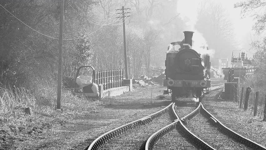 Old style black and white footage of steam train in England UK 4K Royalty-Free Stock Footage #1025327243