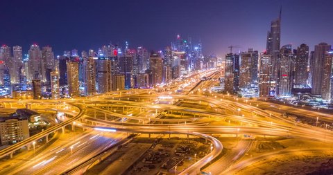 Aerial Flight Over Urban Highway At Night Rush Hour Traffic Metropolitan City Skyline Dubai Business District Low Light Uhd Hdr 4k