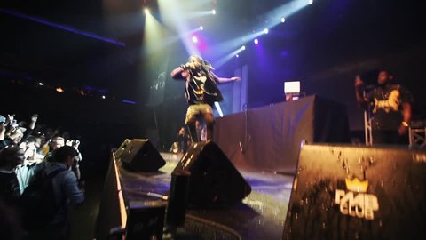 MOSCOW-6 DECEMBER,2014: Concert of rap singer Travis Scott in night club.Big group of young hip hop fans gathered on festival in Glavclub music hall