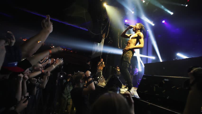 Concert of rap singer Travis Scott.Group of hip hop fans party on festival in music hall.Presentation of Owl Pharaoh album,song Upper Echelon in nightclub. MOSCOW-6 DECEMBER,2014