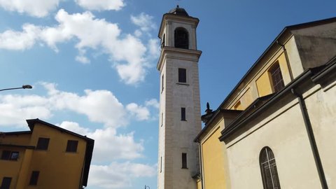 4k video of the bell tower of the church of Cerro al Lambro and its storks, country of the province of milan in lombardy, italy.