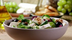 Italian spring salad with goat cheese, grapes and walnuts. Served with croutons. Pour the vinaigrette dressing - Powered by Shutterstock - Get 15% off with code: PIKWIZARD15