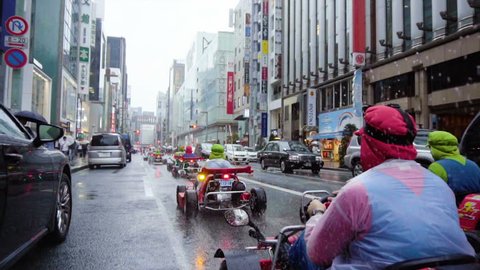 Tourist Cosplayers Driving Mario Go-Karts in Streets of Tokyo, Japan - September, 2018