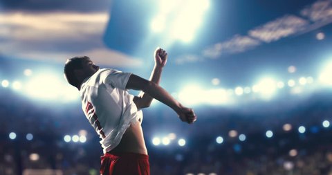 Soccer player succeed in making a strong kick with his head while jumping horizontally. The players is wearing unbranded soccer uniform. Stadium and crowd are made in 3D.