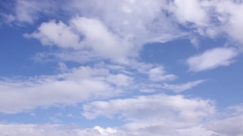 Blue clear summer sky in horizon, beautiful nice rolling clouds time lapse, sun shining with very nice white cloudscape. -UHD.