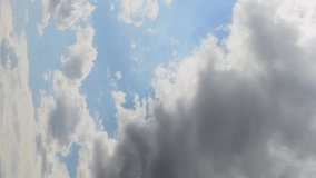 Vertical video. Actively changing clouds, Day