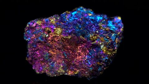 Seamlessly rotating a colorful mineral (Bornite / Peacock Ore) in front of black background. Very intense bright eye-catching colors like the Occamy in the Fantastic Beats