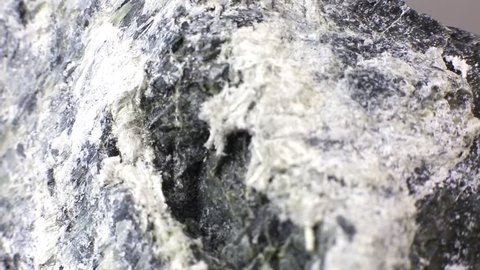 Mineral asbestos macro video. Harmful, dangerous minral. Asbestos fibers in rock close-up.