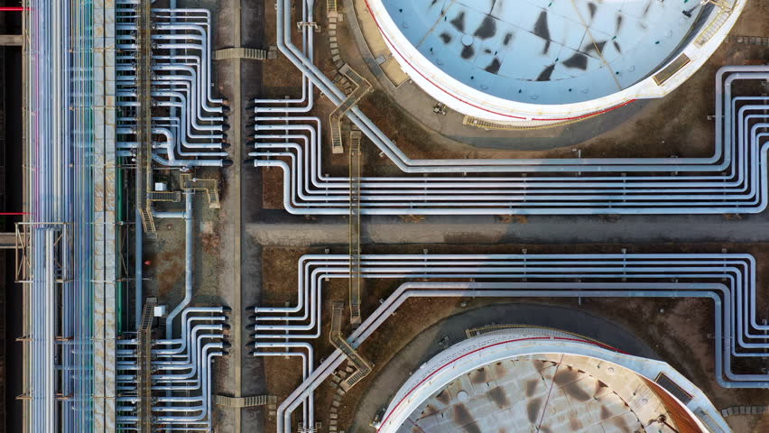 Oil refinery pipeline and storage tank construction architecture plant from industry zone, Aerial view oil and gas fuel chemical industrial, Refinery factory oil storage tank and pipeline steel, 4K | Shutterstock HD Video #1025416985