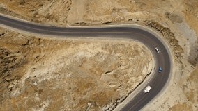Aerial: Winding road (Panamericana) in mountains of Peru. Aerial video. South America