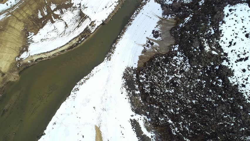 Aerial view of Robbie Creek in winter with a look at the surrounding mountains
