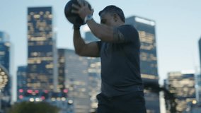 Urban Street Workout / Man 50's working out on night streets of Downtown Los Angeles  - Powered by Shutterstock - Get 15% off with code: PIKWIZARD15