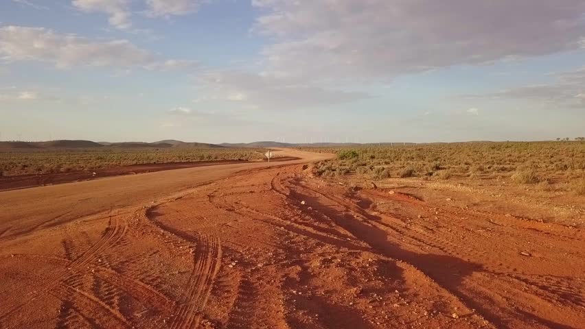 Aerial/Drone Footage taken of an outback red ochre road near Silverton/Broken Hill, New South Wales, Australia Royalty-Free Stock Footage #1025456651