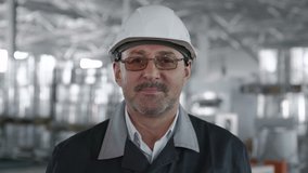 Engineer Plan of Manufacture Work. Caucasian Business People in Hard Hat or Safety Wear. Confident Older Contractor or Attractive Mechanic of Machine Inspection for Machinery Tool Job Close-up Indoors - Powered by Shutterstock - Get 15% off with code: PIKWIZARD15