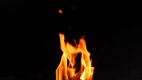 Long, slow motion video of Fire burning over a black background. Easy to mask out or to use simply on black. It burns for a long time in one continuous clip, starting small and ends blazing.