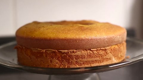 Chocolate icing on carrot cake. Chocolate glaze pouring on homemade cake. Brazilian carrot cake. Topping chocolate on carrot cake. June Partys sweet