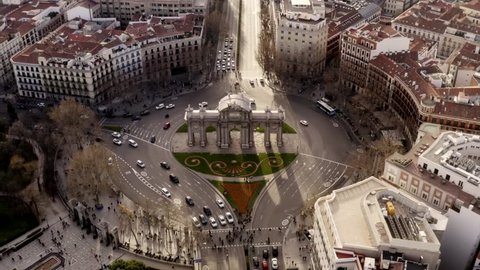 The Puerta de Alcalá in Madrid, Spain. Light traffic around the sight in the city