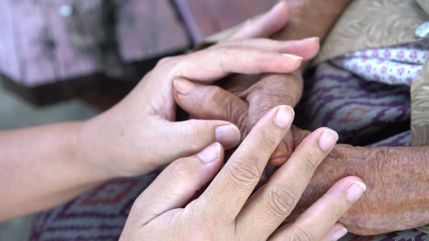 Hands Asian elderly woman grasps her hand on lap, pair of elderly wrinkled hands in prayer and Traces of work hard , World Kindness older and Adult care, Mother day people and older insurance concept | Shutterstock HD Video #1025504255
