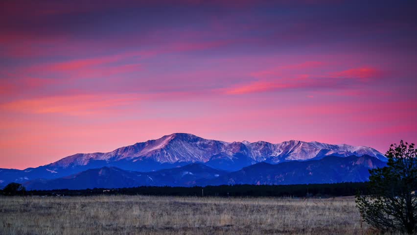 Morning light time lapse of pink sky over Pikes Peak, Colorado.