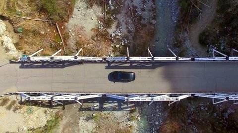 Aerial Drone Fly Over Mountain Creek and Truss Bridge