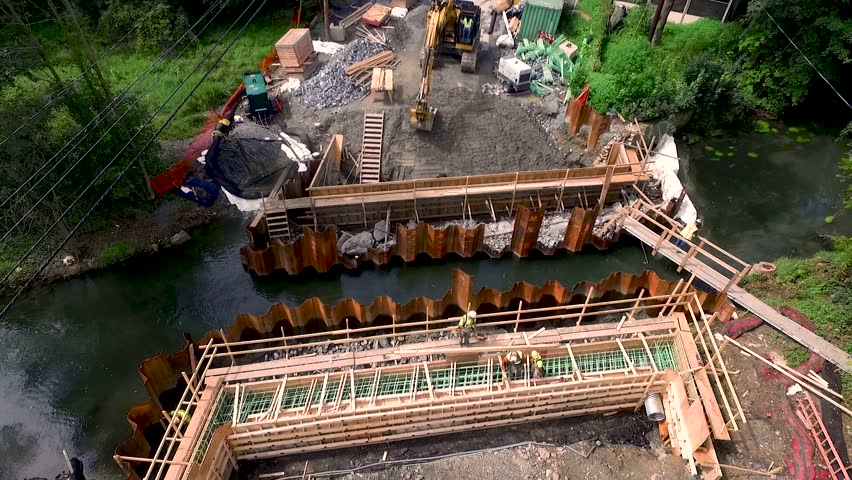 Aerial pull back to reveal bridge replacement construction Lancaster County, Pennsylvania.Concept: renewal, building, men working, construction, public-private partnership, infrastructure