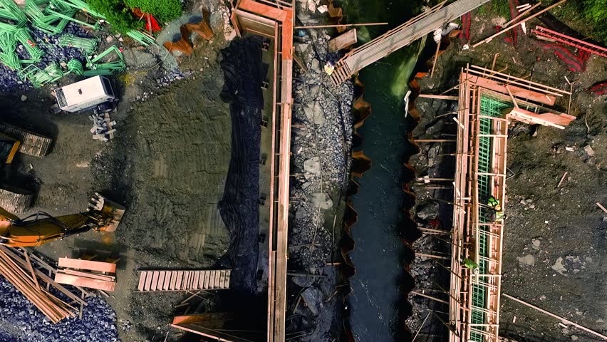 Short aerial descent into a bridge construction site on Lititz RunLancaster County Pennsylvania. Concept: renewal, building, men working, construction, public-private partnership, infrastructure