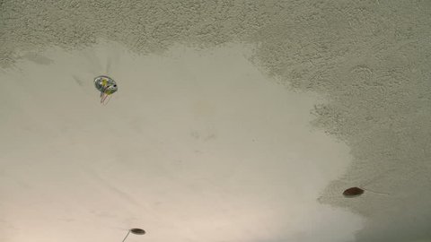 Applying ceiling texture at a home construction site