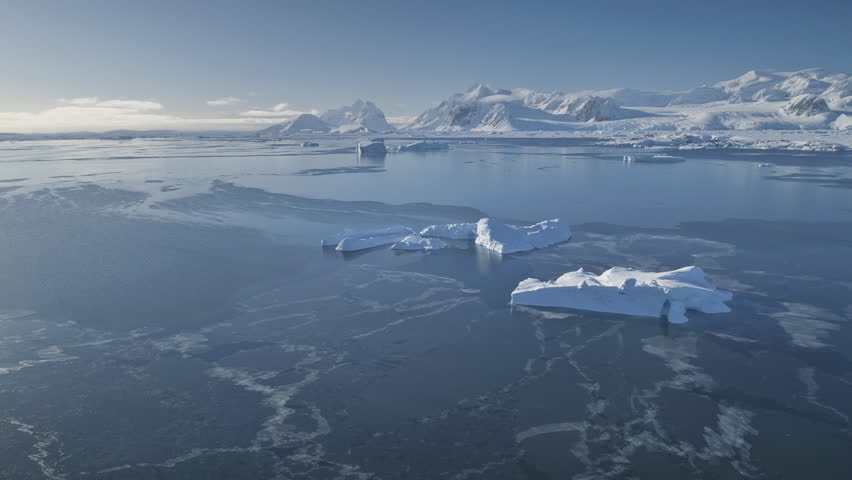Antarctica Aerial Majestic Seascape Drone View. Open Water Antarctic Ocean Coast Nature Mountain Beauty. Cold South Pole Winter Landscape Helicopter Above Pan Left Footage 4K (UHD) | Shutterstock HD Video #1025542298
