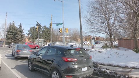 Markham, Ontario, Canada March 2019 Driving plate side view suburban and urban sprawl near Toronto