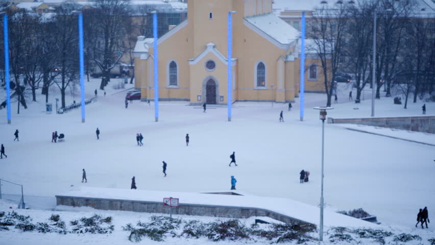 Tallinn, Harjumaa / Estonia - 12 21 2018: People walking in front of St. John