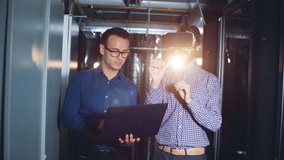 One man is moving in virtual reality glasses under guidance of his colleague - Powered by Shutterstock - Get 15% off with code: PIKWIZARD15