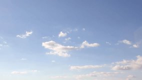 Blue clear summer, sunny sky, time lapse white fast motion clouds, beautiful relaxing weather in horizon, panoramic view, fluffy, puffy cloudscape. -UHD.