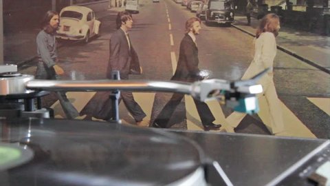 Naples, Italy, 10/03/2019. The fabulous Beatles depicted as they cross on the pedestrian crossing, on the cover of their most famous album Abbey Road.