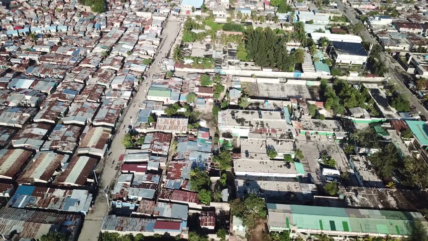 Haiti Cite Soleil Aerial, undeveloped area with poor people, tin roof and dirty sea. 2018