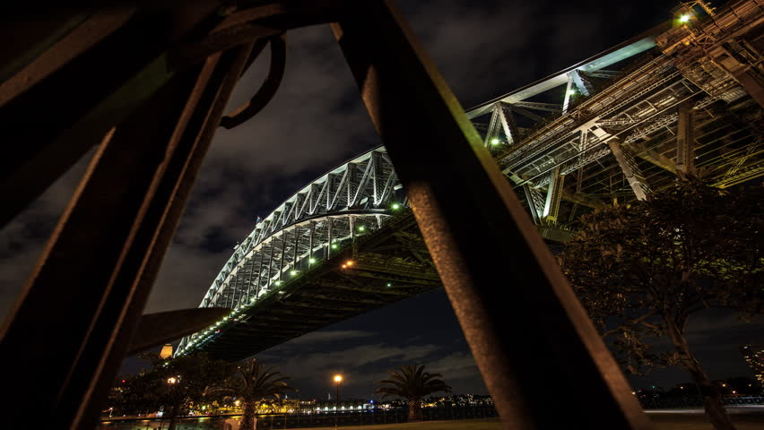 Time lapse moving forward from under a bridge, night