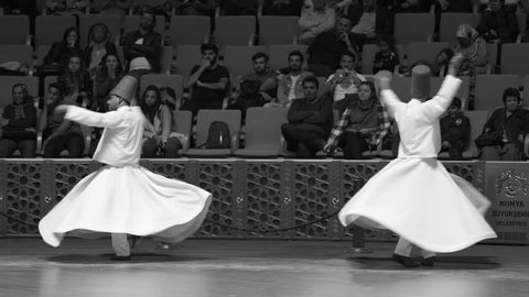 Konya, Turkey - October 20, 2018: Semazen or Whirling Dervishes at Mevlana Culture Center in Konya, Turkey. Black and white video