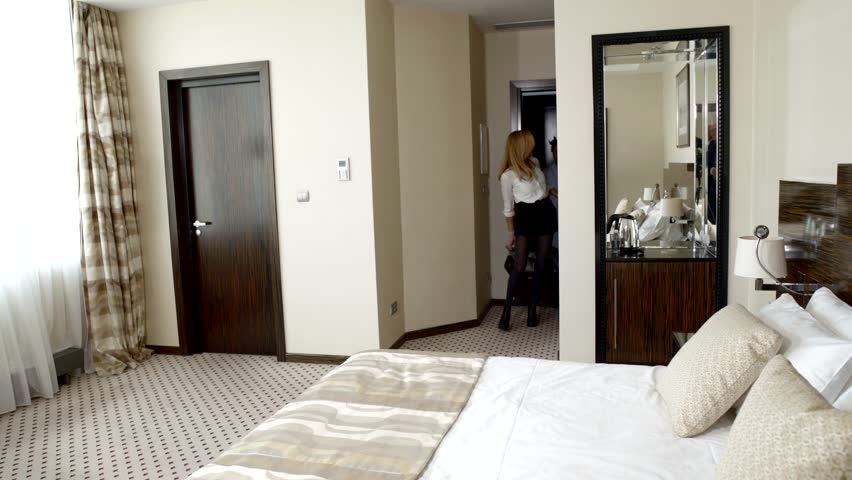 Couple on vacation having sex in a hotel room