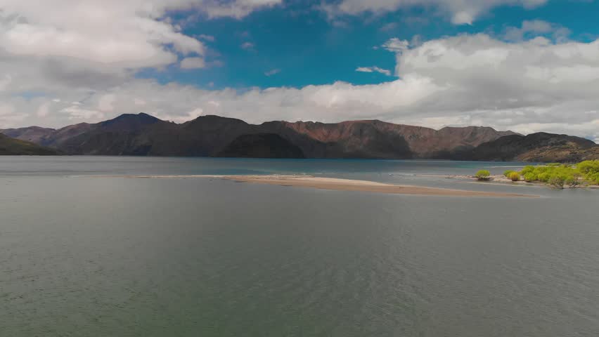 Aerial drone footage of Emerald Bluffs part of Wanaka Lake, South Island, New Zealand | Shutterstock HD Video #1025600408