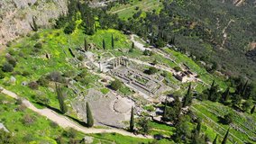 Aerial drone video of iconic Temple of Apollo in archaeological site of Delphi one of the most important of Ancient times, Fokida prefecture, Greece