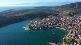 Aerial drone video from famous picturesque and traditional marine village of Galaxidi with unique character, Fokida, Greece