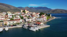 Aerial drone video from famous picturesque and traditional marine village of Galaxidi with unique character, Fokida, Greece