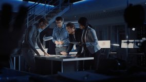 Diverse Team of Electronics Development Engineers Standing at the Desk Working with Documents, Solving Project Problems Late at Night. Specialists Working on Ultra Modern Industrial Design.Slow Motion - Powered by Shutterstock - Get 15% off with code: PIKWIZARD15