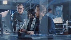 Two Electronics Development Engineers Working on Computers, Talk with Project Manager. Team of Professionals Use CAD Software for the Modern Industrial Engineering Design. Slow Motion Shot - Powered by Shutterstock - Get 15% off with code: PIKWIZARD15