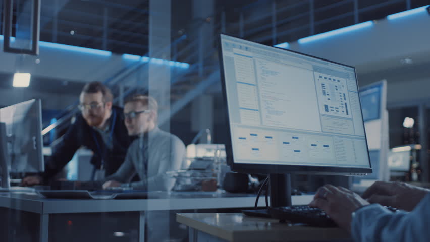 Electronics Development Engineer Uses Personal Computer Talks with Manager, Shows Project. Team of Professionals Use Digital Whiteboard use CAD Software for the Modern Industrial Engineering Design Royalty-Free Stock Footage #1025609654