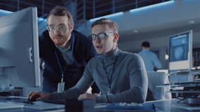 Electronics Development Engineer Uses Personal Computer Talks with Manager, Shows Project. Team of Professionals Use Digital Whiteboard use CAD Software for the Modern Industrial Engineering Design - Powered by Shutterstock - Get 15% off with code: PIKWIZARD15