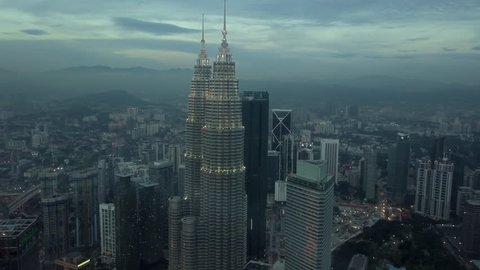 KUALA LUMPUR MALAYSIA - FEBRUARY 12th 2019: Short video clip of Kuala Lumpur City Centre (KLCC) and KL Tower Petronas Twin Towers during dusk time.