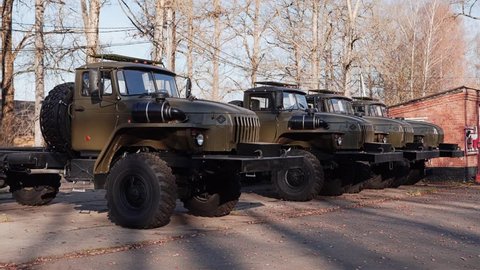 Military tractors without trailers are in a row in the Parking lot